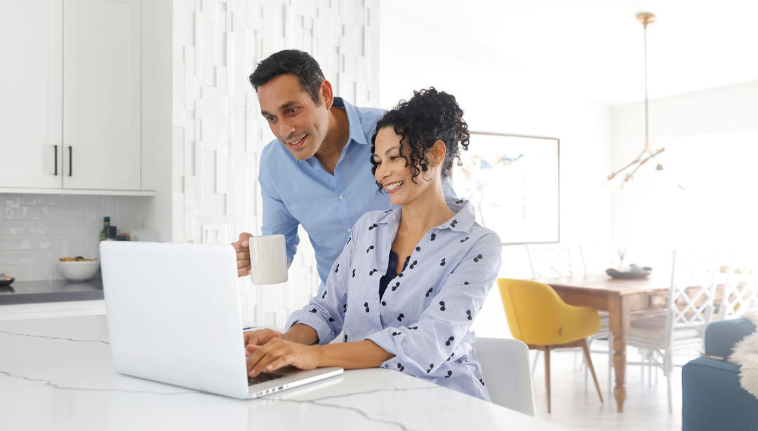 Couple looking at laptop