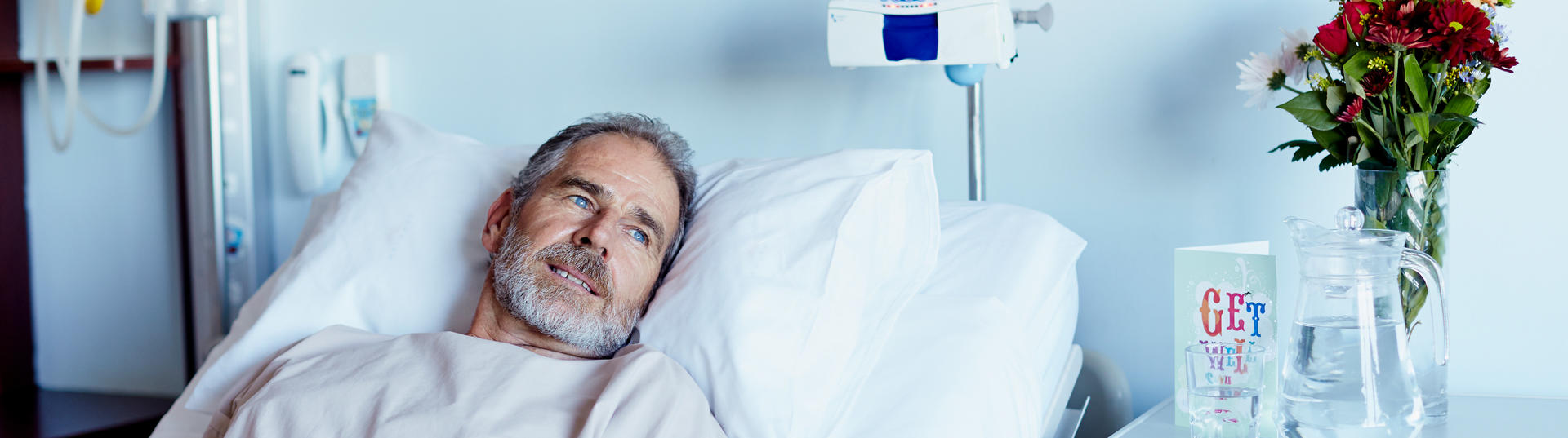 man in hospital bed