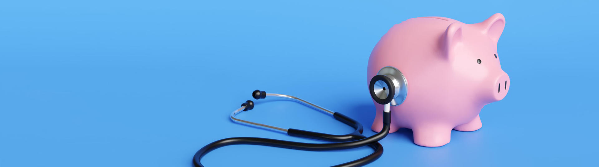 Black stethoscope on the body of a pink piggy bank in blue background