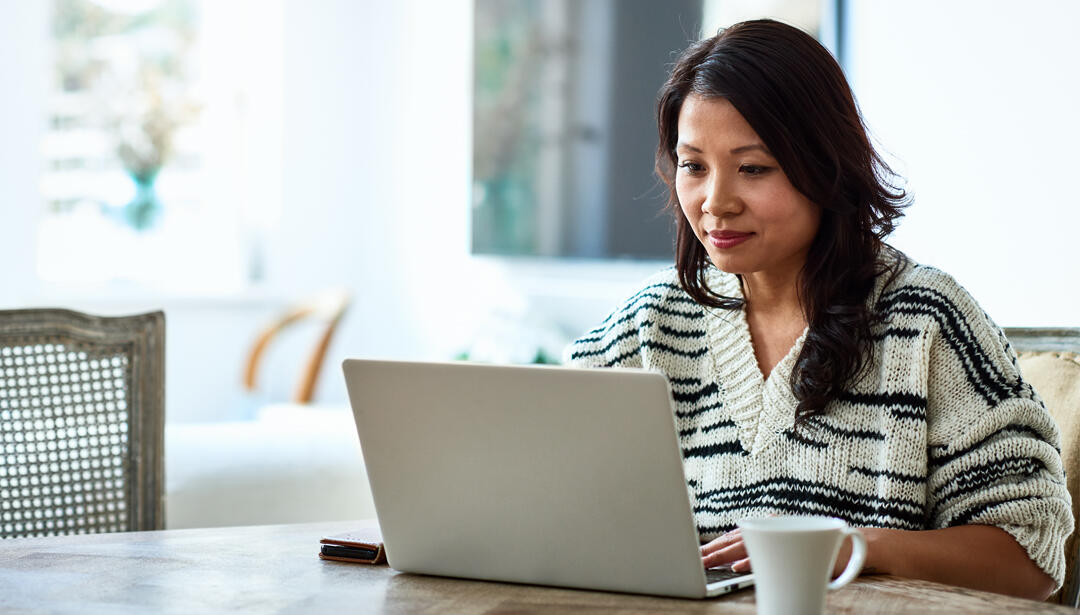 woman working on laptop at table