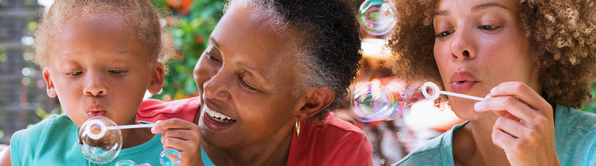 family blowing bubbles